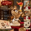 Факел белән Олимпия Аюы статуэткасы